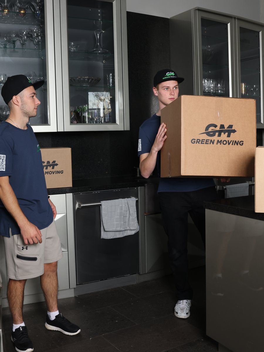 Movers packing a kitchen into boxes